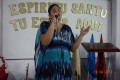 Angela, the Pastor with husband Jesus, leading worship beautifully